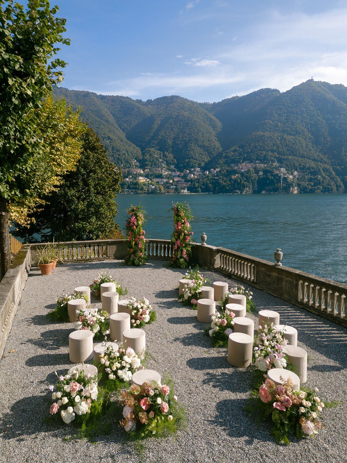 Floral ceremony seating on the terrace above Lake Como