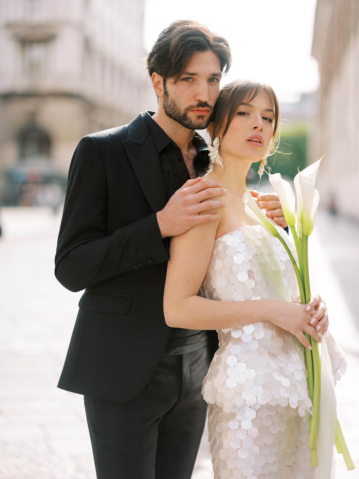 Couple in black and a sequined gown with calla lilies, Milan