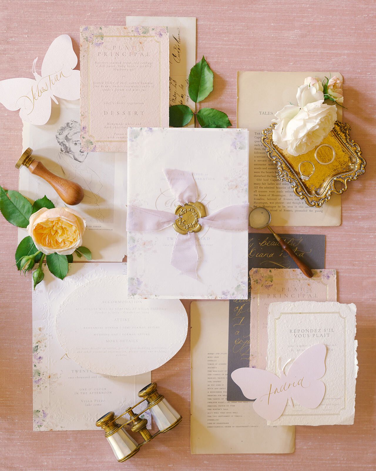 Pastel stationery flat lay with a wax seal and perfume bottle