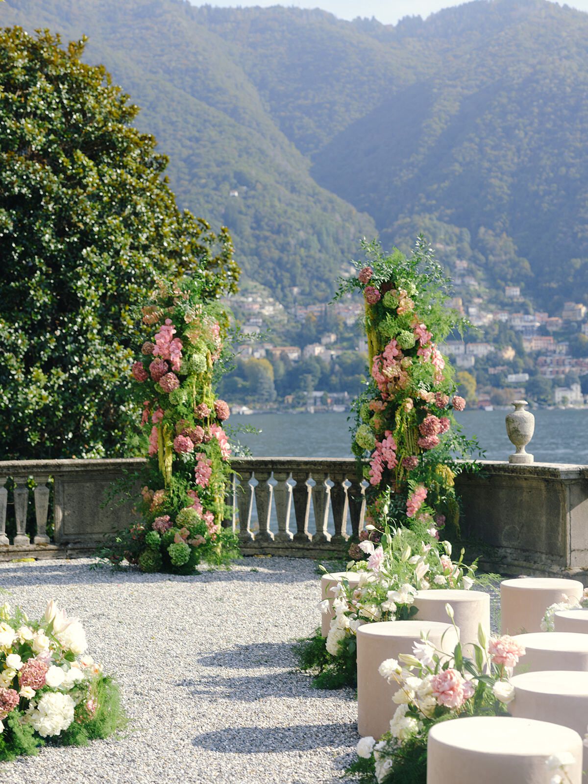 Floral arches and ceremony seating overlooking Lake Como