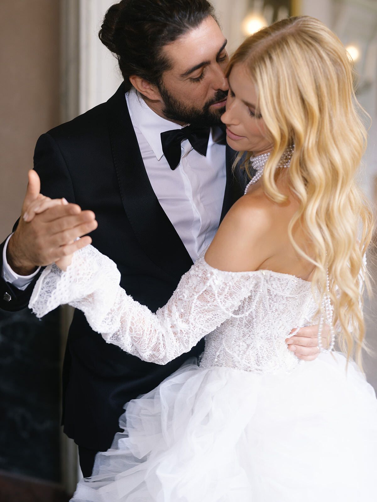 Groom and bride dancing indoors at Villa Pizzo